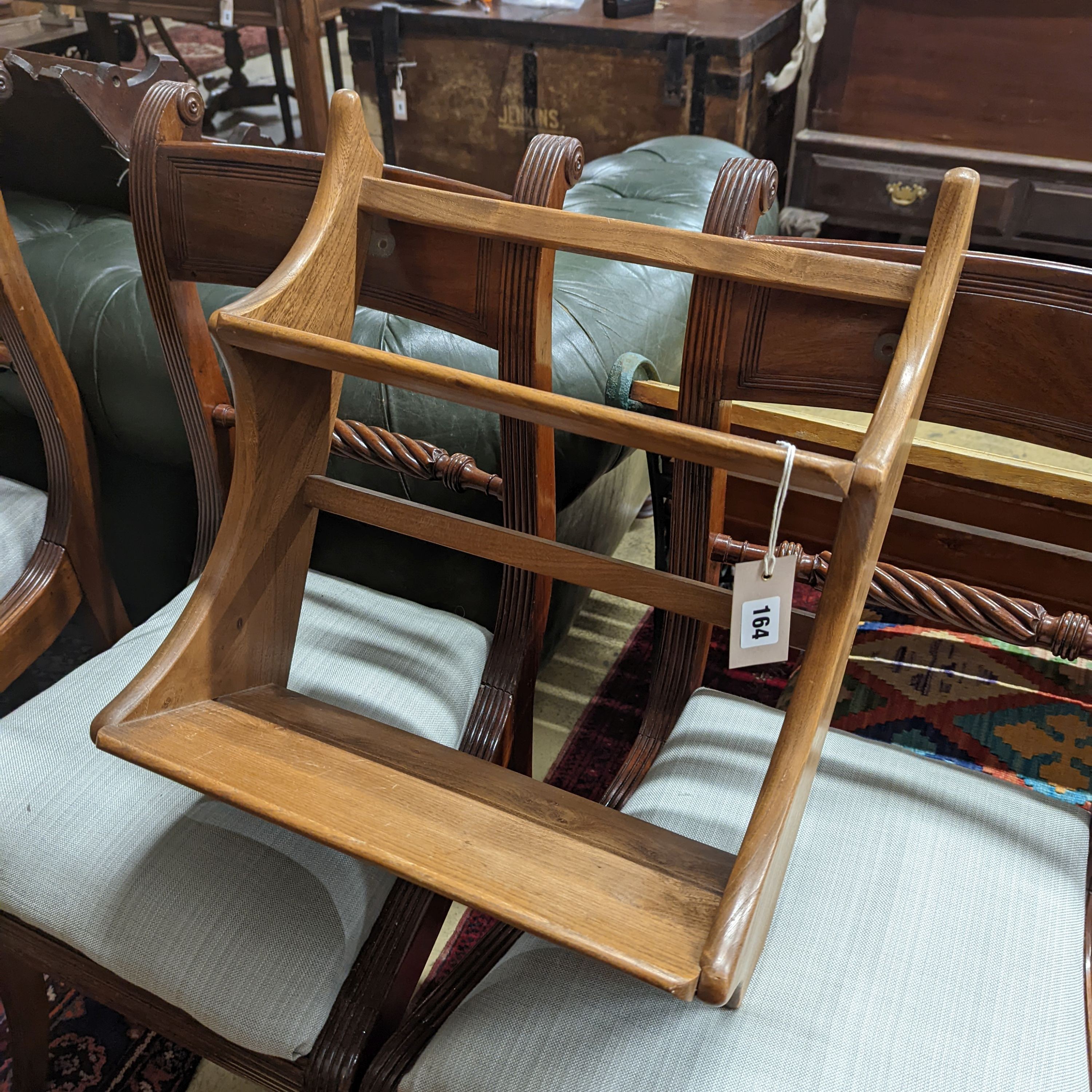 An Ercol elm two tier wall bracket, length 43cm, height 52cm